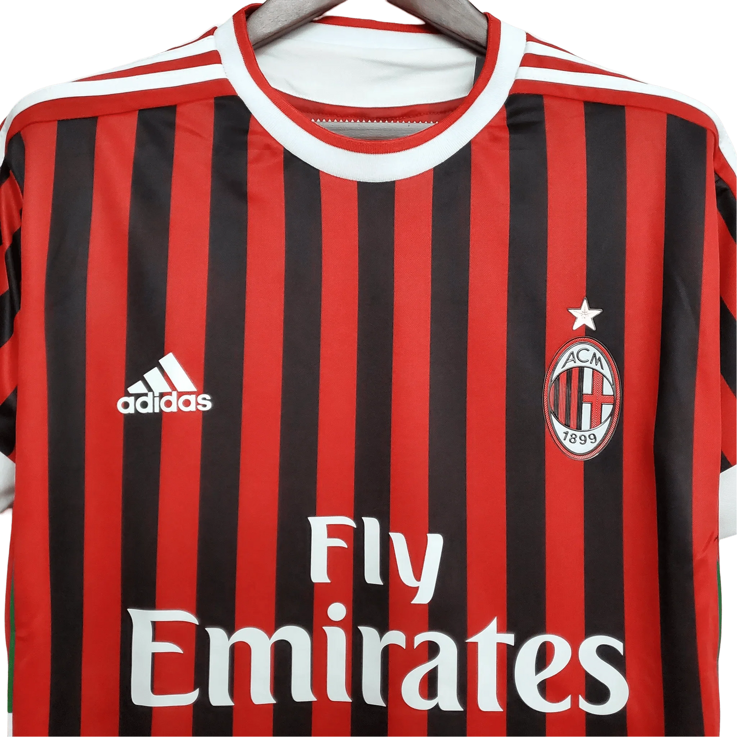https://cdn.shopify.com/s/files/1/0826/7228/8075/files/20112012-ac-milan-fly-emirates-home-retro-kit-358162.webp?v=1741197296