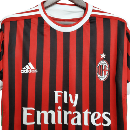 https://cdn.shopify.com/s/files/1/0826/7228/8075/files/20112012-ac-milan-fly-emirates-home-retro-kit-358162.webp?v=1741197296