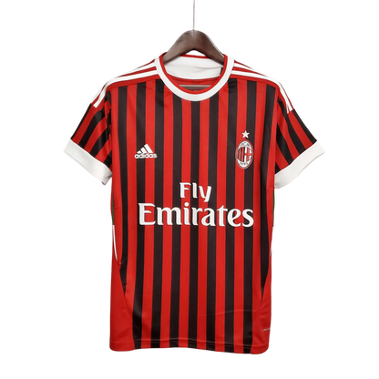 https://cdn.shopify.com/s/files/1/0826/7228/8075/files/20112012-ac-milan-fly-emirates-home-retro-kit-547617.webp?v=1741197296