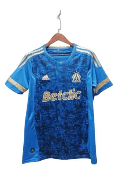 https://cdn.shopify.com/s/files/1/0826/7228/8075/files/20112012-olympique-de-marseille-betclic-blue-away-retro-jersey-735580.webp?v=1741197997