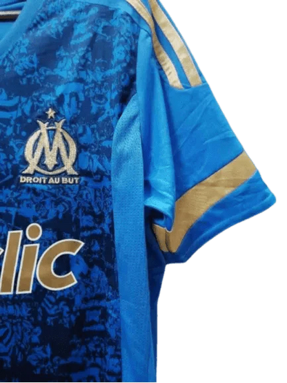 https://cdn.shopify.com/s/files/1/0826/7228/8075/files/20112012-olympique-de-marseille-betclic-blue-away-retro-jersey-947654.webp?v=1741197998