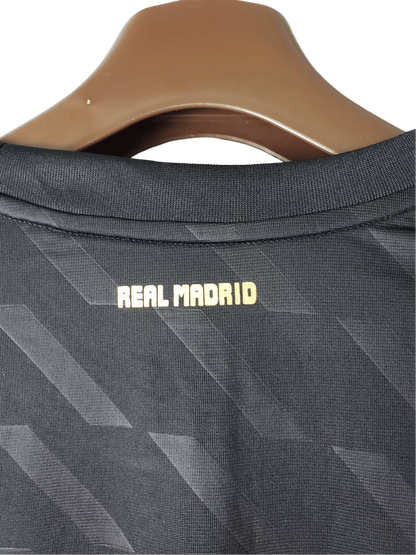 https://cdn.shopify.com/s/files/1/0826/7228/8075/files/20112012-real-madrid-bwin-away-retro-kit-long-sleeve-807463.webp?v=1741197458