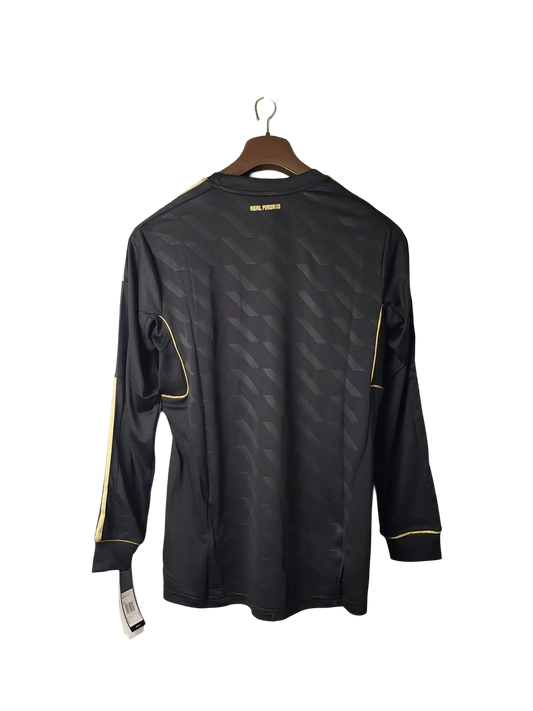 https://cdn.shopify.com/s/files/1/0826/7228/8075/files/20112012-real-madrid-bwin-away-retro-kit-long-sleeve-985514.webp?v=1741197455