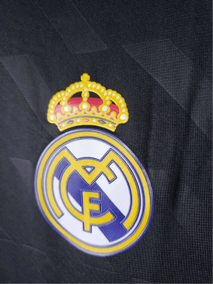 https://cdn.shopify.com/s/files/1/0826/7228/8075/files/20112012-real-madrid-bwin-away-retro-kit-short-sleeve-185972.webp?v=1741197467