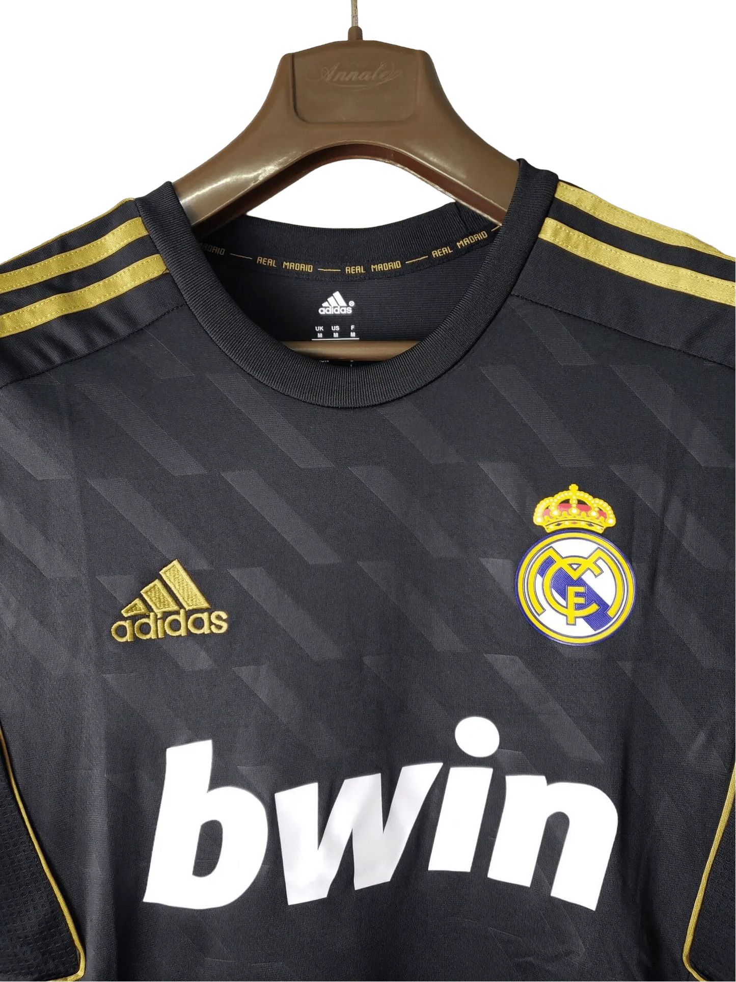 https://cdn.shopify.com/s/files/1/0826/7228/8075/files/20112012-real-madrid-bwin-away-retro-kit-short-sleeve-416214.webp?v=1741197468