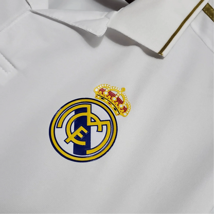 https://cdn.shopify.com/s/files/1/0826/7228/8075/files/20112012-real-madrid-bwin-home-retro-kit-long-sleeve-163621.webp?v=1741197495