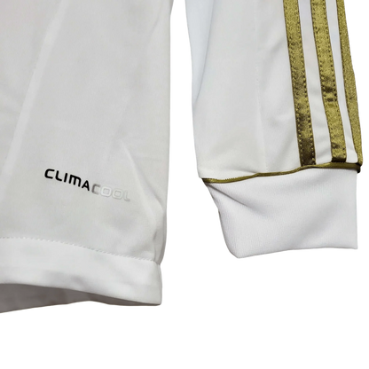https://cdn.shopify.com/s/files/1/0826/7228/8075/files/20112012-real-madrid-bwin-home-retro-kit-long-sleeve-939342.webp?v=1741197495