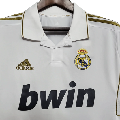 https://cdn.shopify.com/s/files/1/0826/7228/8075/files/20112012-real-madrid-bwin-home-retro-kit-short-sleeve-345683.webp?v=1741197491