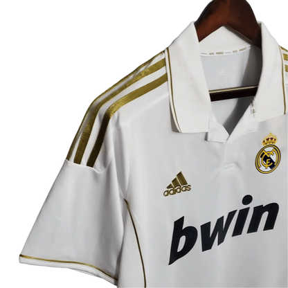 https://cdn.shopify.com/s/files/1/0826/7228/8075/files/20112012-real-madrid-bwin-home-retro-kit-short-sleeve-766333.webp?v=1741197489