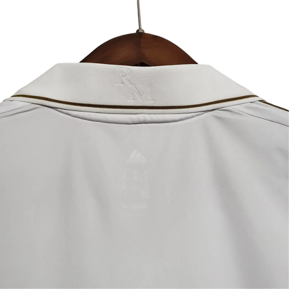 https://cdn.shopify.com/s/files/1/0826/7228/8075/files/20112012-real-madrid-bwin-home-retro-kit-short-sleeve-770279.webp?v=1741197490