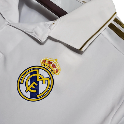 https://cdn.shopify.com/s/files/1/0826/7228/8075/files/20112012-real-madrid-bwin-home-retro-kit-short-sleeve-841012.webp?v=1741197491