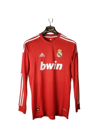 https://cdn.shopify.com/s/files/1/0826/7228/8075/files/20112012-real-madrid-bwin-third-retro-kit-long-sleeve-873071.webp?v=1741197462