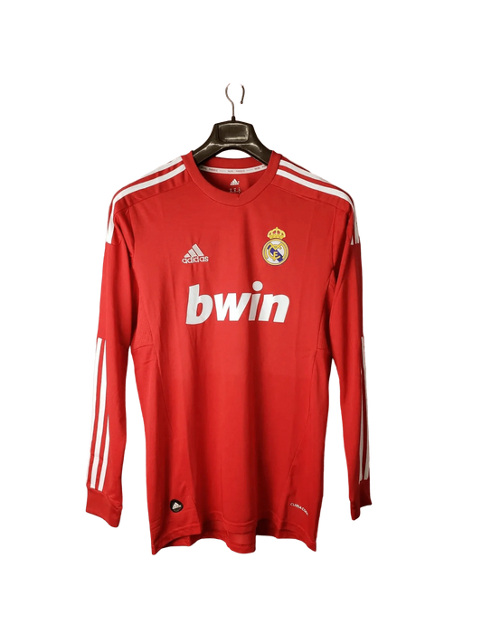 https://cdn.shopify.com/s/files/1/0826/7228/8075/files/20112012-real-madrid-bwin-third-retro-kit-long-sleeve-873071.webp?v=1741197462
