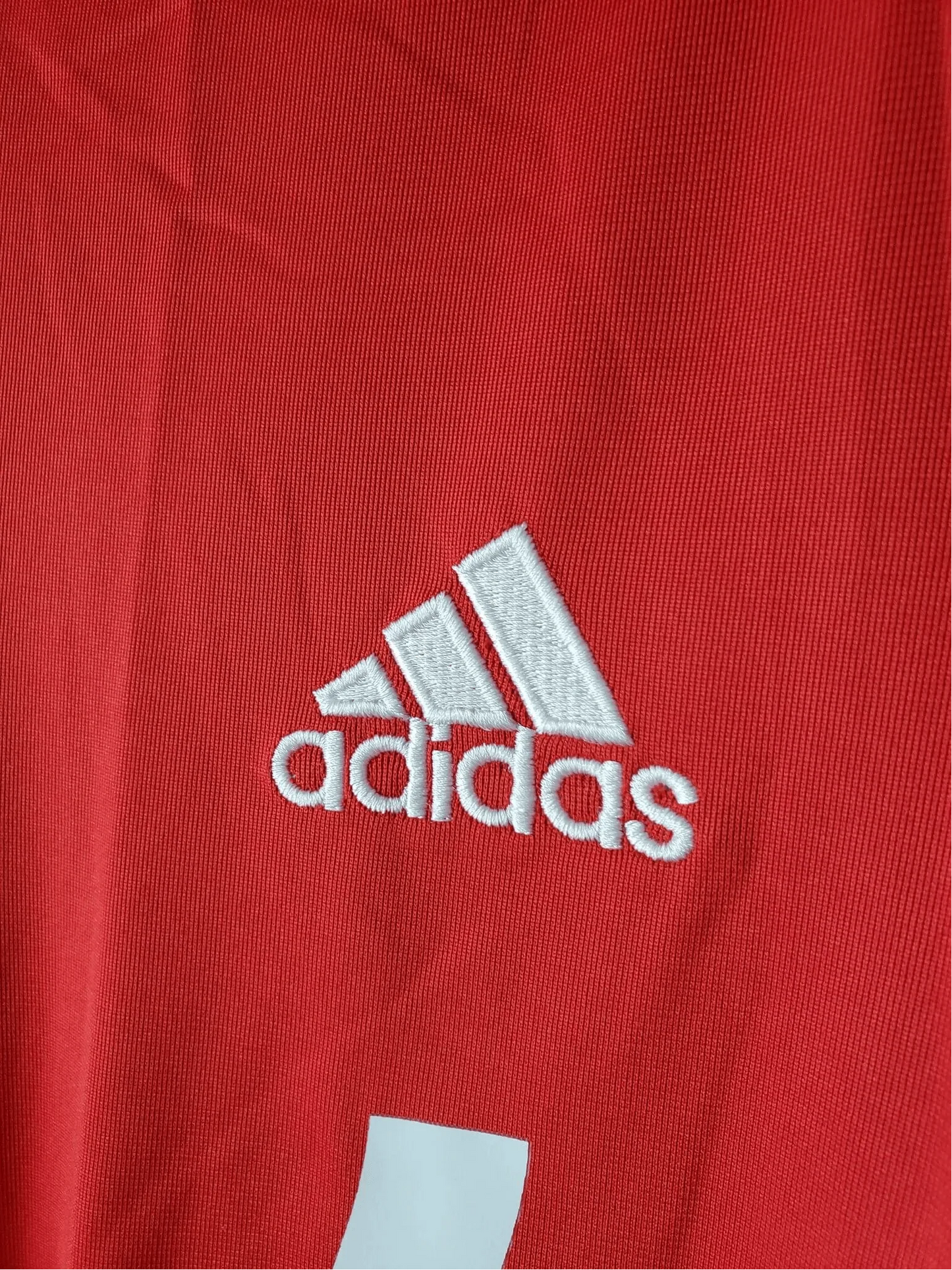 https://cdn.shopify.com/s/files/1/0826/7228/8075/files/20112012-real-madrid-bwin-third-retro-kit-short-sleeve-826676.webp?v=1741197442