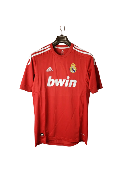 https://cdn.shopify.com/s/files/1/0826/7228/8075/files/20112012-real-madrid-bwin-third-retro-kit-short-sleeve-993437.webp?v=1741197440