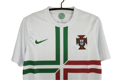 https://cdn.shopify.com/s/files/1/0826/7228/8075/files/2012-portugal-away-white-retro-kit-579523.webp?v=1741197028