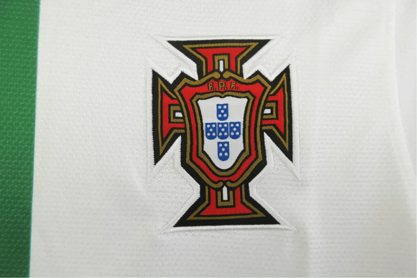 https://cdn.shopify.com/s/files/1/0826/7228/8075/files/2012-portugal-away-white-retro-kit-961791.webp?v=1741197030