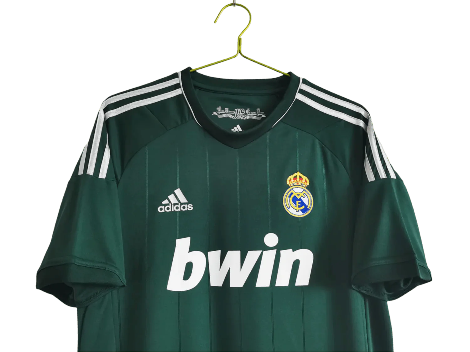 https://cdn.shopify.com/s/files/1/0826/7228/8075/files/20122013-real-madrid-bwin-3rd-green-retro-kit-122239.webp?v=1741197482