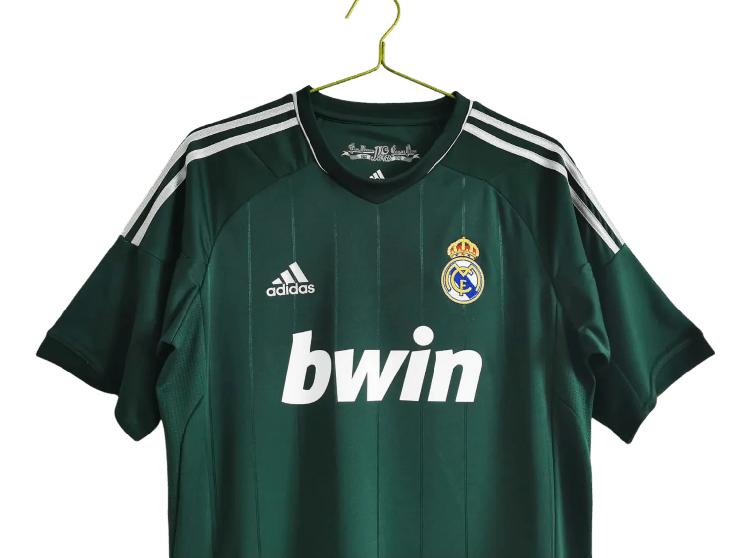 https://cdn.shopify.com/s/files/1/0826/7228/8075/files/20122013-real-madrid-bwin-3rd-green-retro-kit-312916.webp?v=1741197484