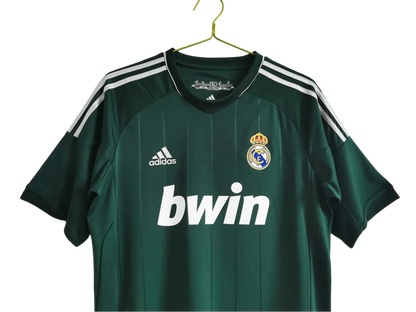 https://cdn.shopify.com/s/files/1/0826/7228/8075/files/20122013-real-madrid-bwin-3rd-green-retro-kit-312916.webp?v=1741197484