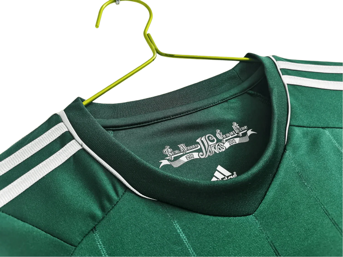 https://cdn.shopify.com/s/files/1/0826/7228/8075/files/20122013-real-madrid-bwin-3rd-green-retro-kit-359262.webp?v=1741197538
