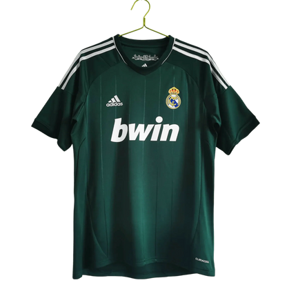 https://cdn.shopify.com/s/files/1/0826/7228/8075/files/20122013-real-madrid-bwin-3rd-green-retro-kit-468717.webp?v=1741197480