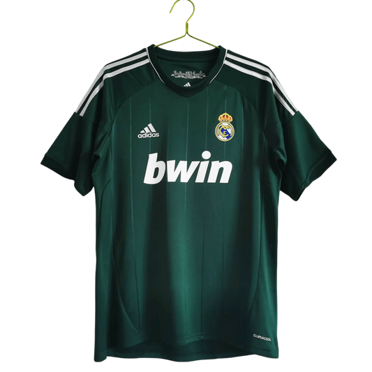 https://cdn.shopify.com/s/files/1/0826/7228/8075/files/20122013-real-madrid-bwin-3rd-green-retro-kit-468717.webp?v=1741197480
