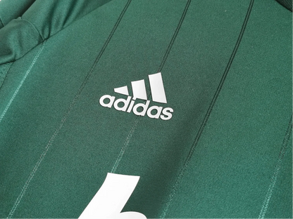 https://cdn.shopify.com/s/files/1/0826/7228/8075/files/20122013-real-madrid-bwin-3rd-green-retro-kit-686554.webp?v=1741197482