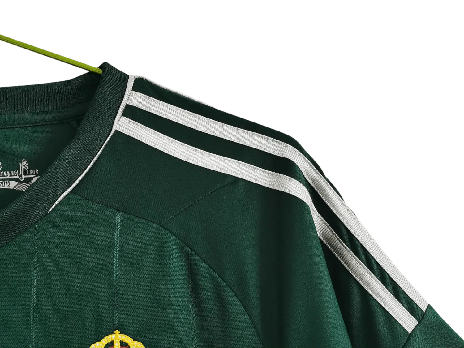 https://cdn.shopify.com/s/files/1/0826/7228/8075/files/20122013-real-madrid-bwin-3rd-green-retro-kit-735579.webp?v=1741197482