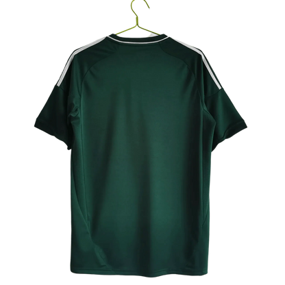 https://cdn.shopify.com/s/files/1/0826/7228/8075/files/20122013-real-madrid-bwin-3rd-green-retro-kit-869160.webp?v=1741197479