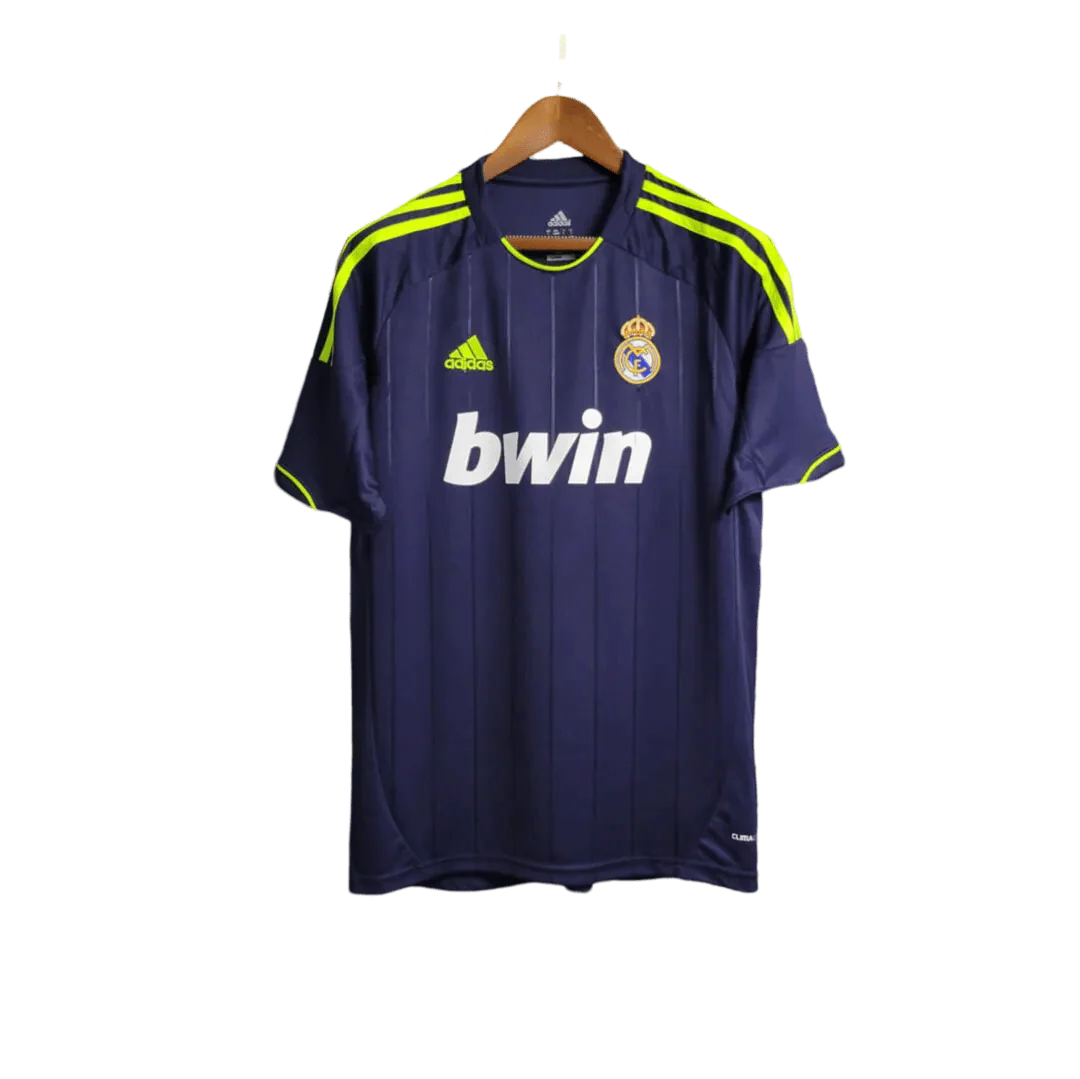 https://cdn.shopify.com/s/files/1/0826/7228/8075/files/20122013-real-madrid-bwin-away-retro-kit-203331.webp?v=1741197474