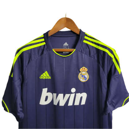 https://cdn.shopify.com/s/files/1/0826/7228/8075/files/20122013-real-madrid-bwin-away-retro-kit-377074.webp?v=1741197478