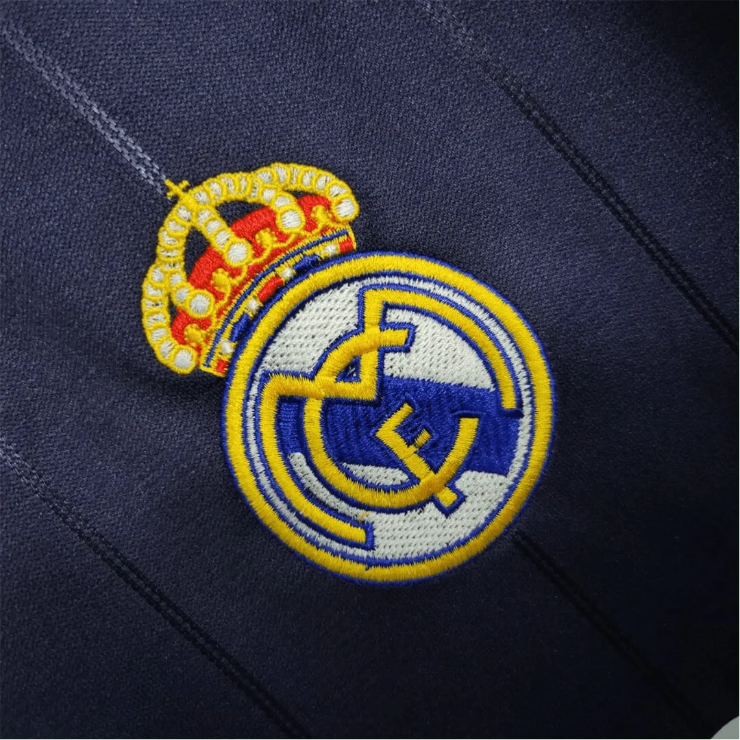 https://cdn.shopify.com/s/files/1/0826/7228/8075/files/20122013-real-madrid-bwin-away-retro-kit-401413.webp?v=1741197475