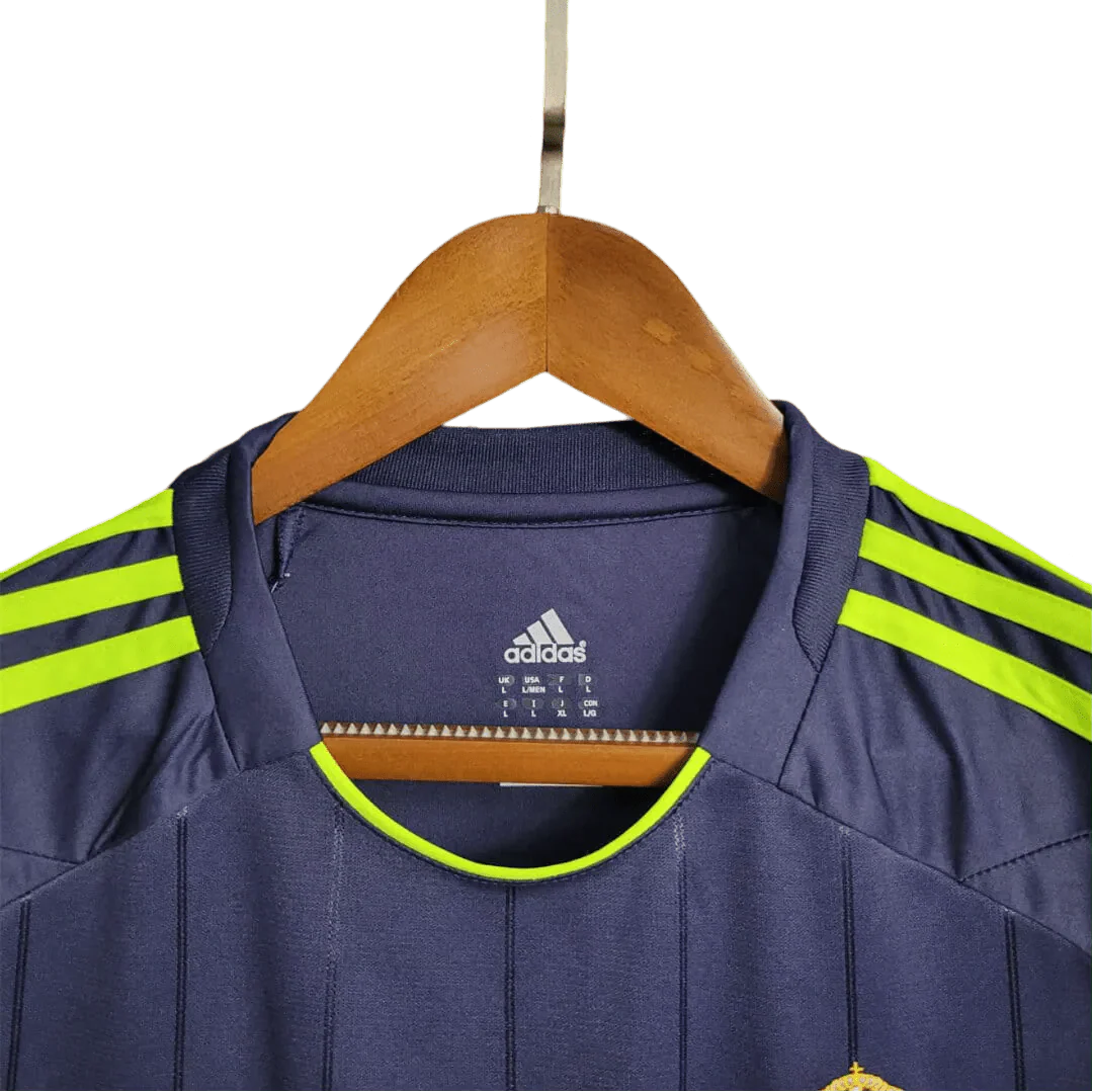 https://cdn.shopify.com/s/files/1/0826/7228/8075/files/20122013-real-madrid-bwin-away-retro-kit-458940.webp?v=1741197478