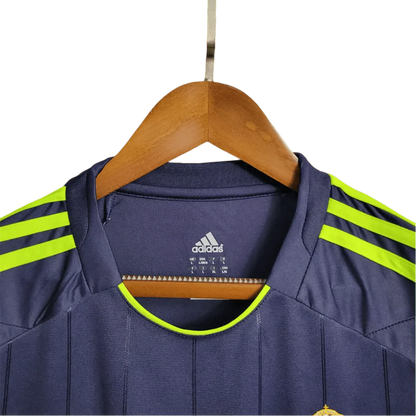https://cdn.shopify.com/s/files/1/0826/7228/8075/files/20122013-real-madrid-bwin-away-retro-kit-458940.webp?v=1741197478