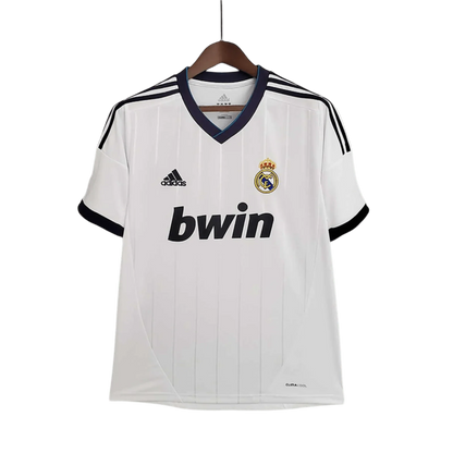 https://cdn.shopify.com/s/files/1/0826/7228/8075/files/20122013-real-madrid-bwin-home-retro-kit-112930.webp?v=1741197436