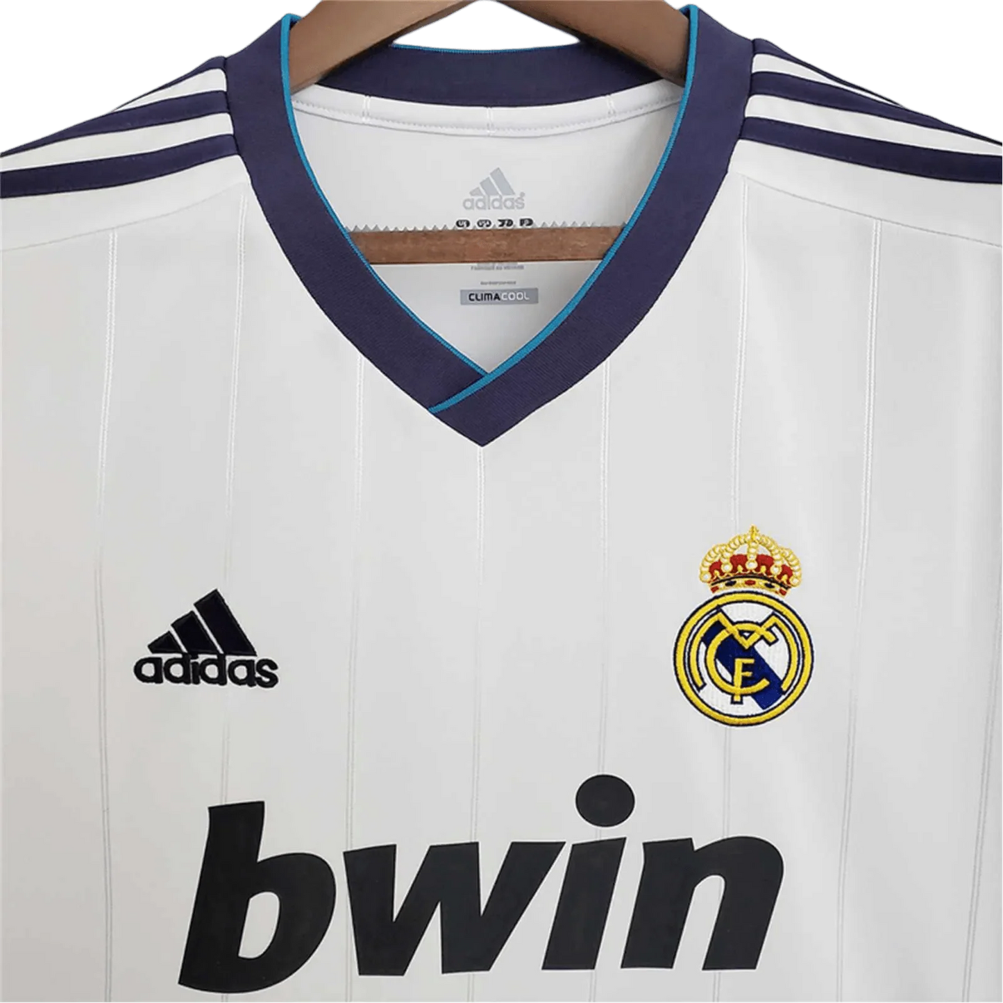https://cdn.shopify.com/s/files/1/0826/7228/8075/files/20122013-real-madrid-bwin-home-retro-kit-230856.webp?v=1741197436