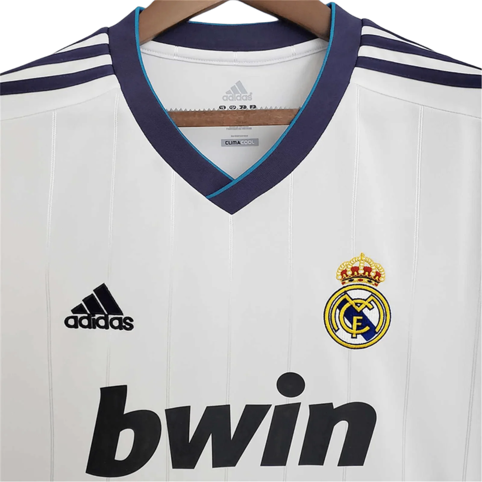 https://cdn.shopify.com/s/files/1/0826/7228/8075/files/20122013-real-madrid-bwin-home-retro-kit-230856.webp?v=1741197436