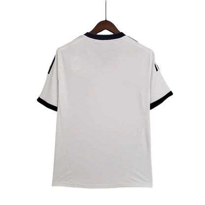 https://cdn.shopify.com/s/files/1/0826/7228/8075/files/20122013-real-madrid-bwin-home-retro-kit-332341.webp?v=1741197436