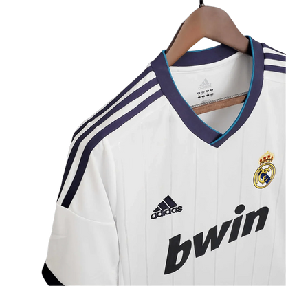 https://cdn.shopify.com/s/files/1/0826/7228/8075/files/20122013-real-madrid-bwin-home-retro-kit-467394.webp?v=1741197439