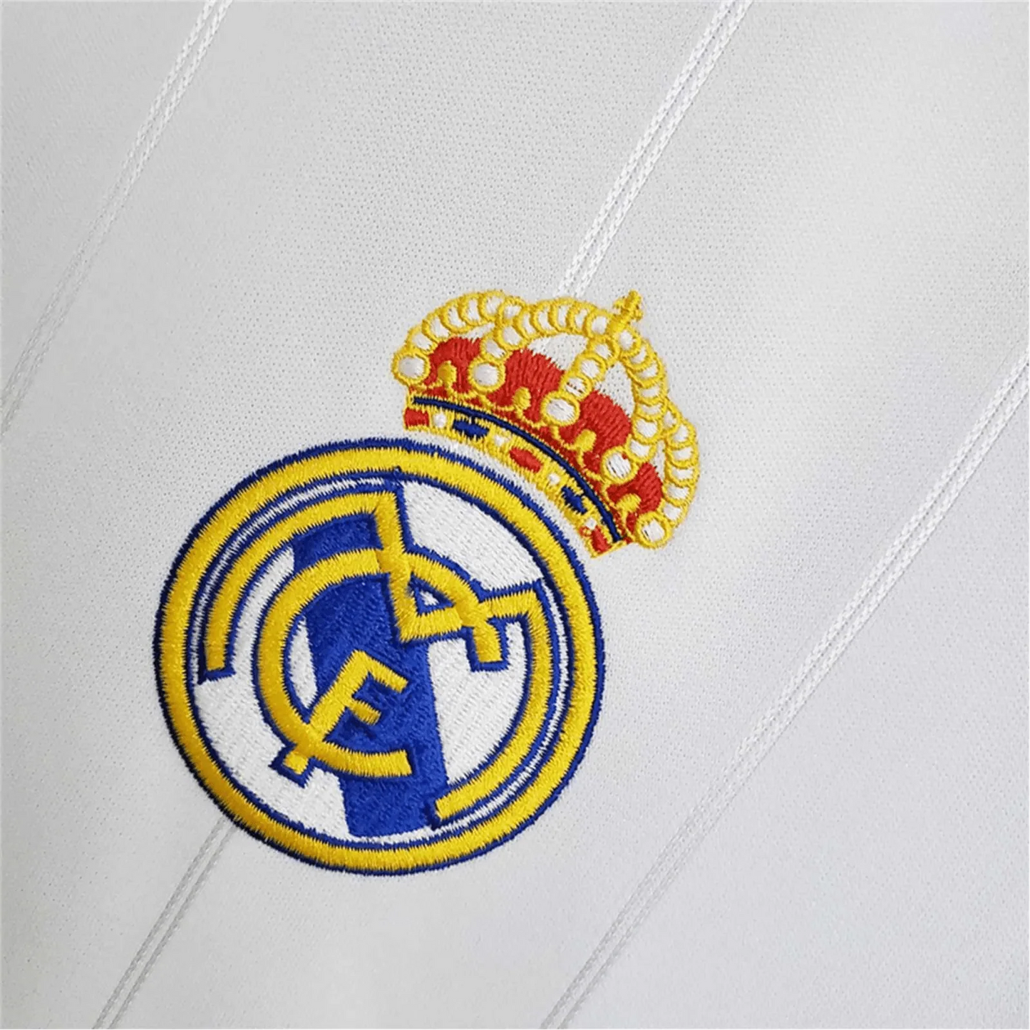 https://cdn.shopify.com/s/files/1/0826/7228/8075/files/20122013-real-madrid-bwin-home-retro-kit-483879.webp?v=1741197437