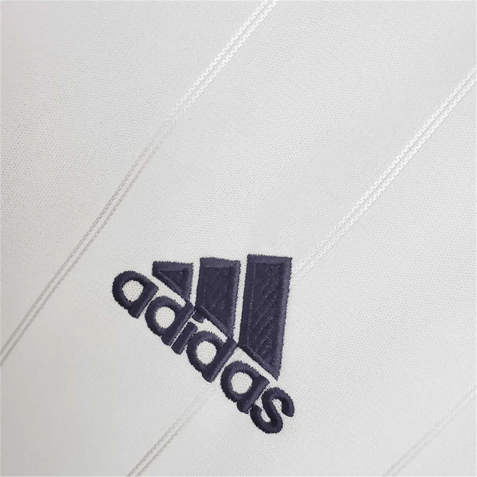 https://cdn.shopify.com/s/files/1/0826/7228/8075/files/20122013-real-madrid-bwin-home-retro-kit-996084.webp?v=1741197438
