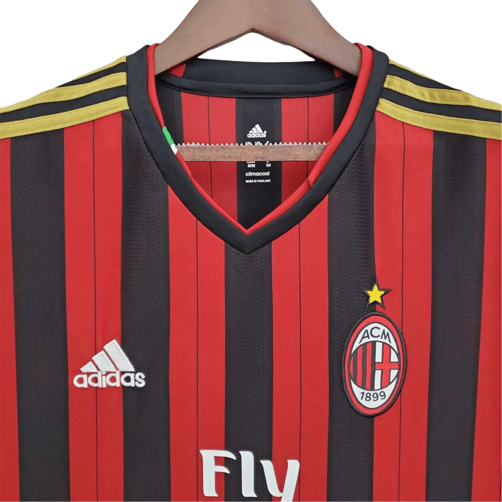 https://cdn.shopify.com/s/files/1/0826/7228/8075/files/20132014-ac-milan-fly-emirates-home-retro-kit-518328.webp?v=1741197451