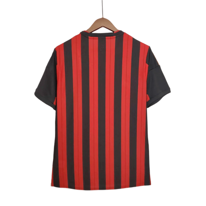 https://cdn.shopify.com/s/files/1/0826/7228/8075/files/20132014-ac-milan-fly-emirates-home-retro-kit-654013.webp?v=1741197451