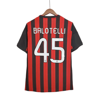 https://cdn.shopify.com/s/files/1/0826/7228/8075/files/20132014-ac-milan-fly-emirates-home-retro-kit-702622.webp?v=1741197452