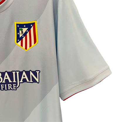 https://cdn.shopify.com/s/files/1/0826/7228/8075/files/20132014-atletico-madrid-azerbaijan-away-retro-kit-classickits433-127236.webp?v=1741198258