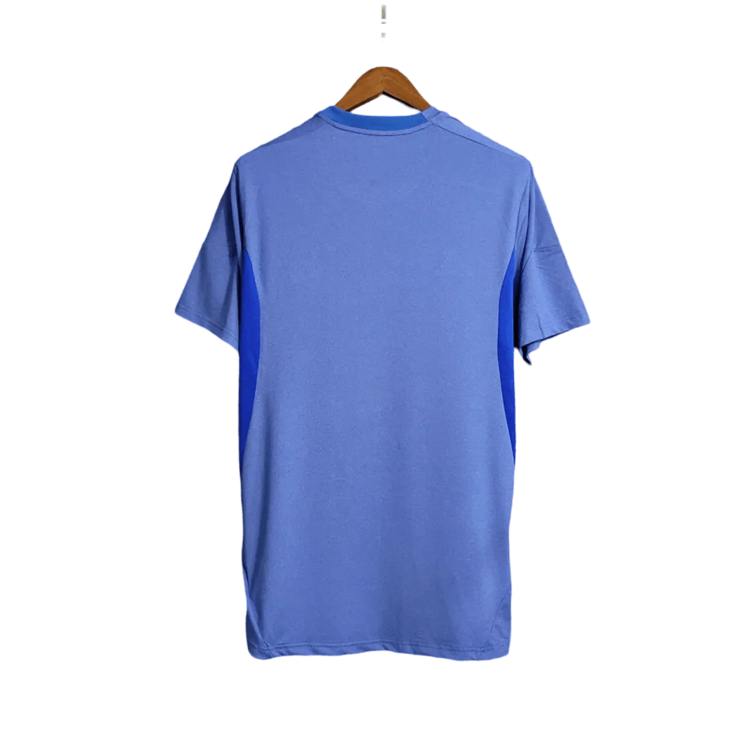 https://cdn.shopify.com/s/files/1/0826/7228/8075/files/20132014-real-madrid-fly-emirates-away-retro-kit-258600.webp?v=1741197456