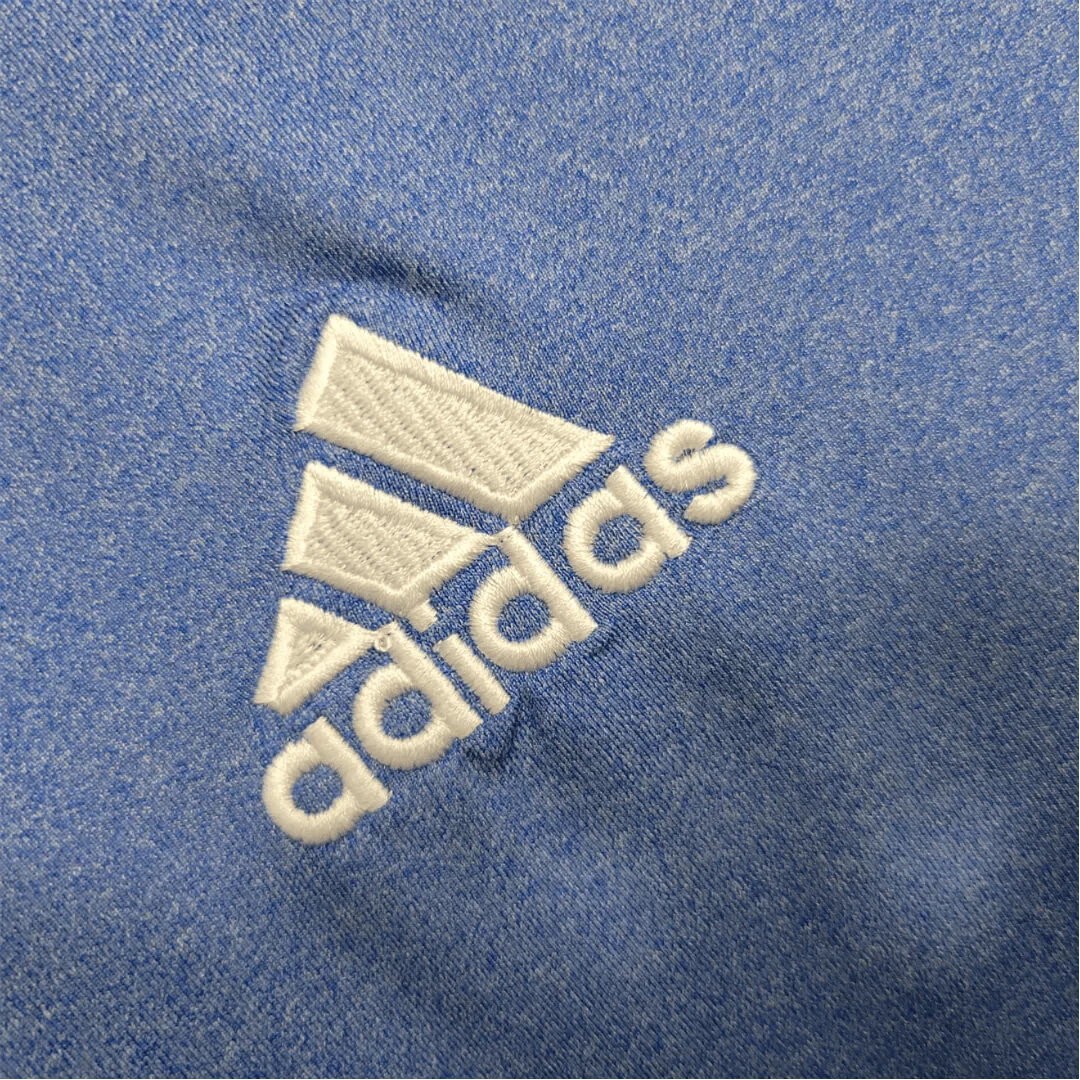 https://cdn.shopify.com/s/files/1/0826/7228/8075/files/20132014-real-madrid-fly-emirates-away-retro-kit-581114.webp?v=1741197456