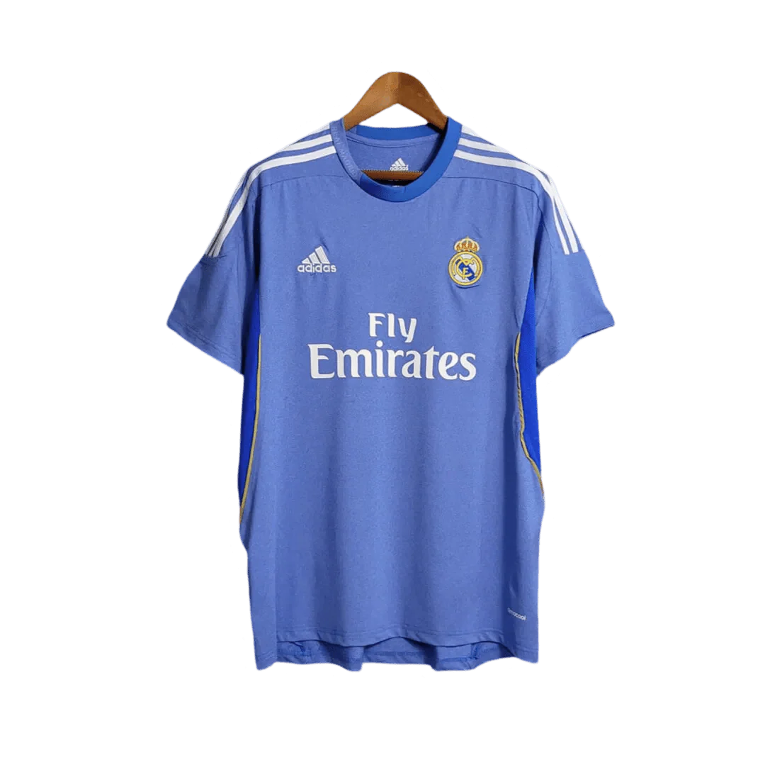 https://cdn.shopify.com/s/files/1/0826/7228/8075/files/20132014-real-madrid-fly-emirates-away-retro-kit-866954.webp?v=1741197459