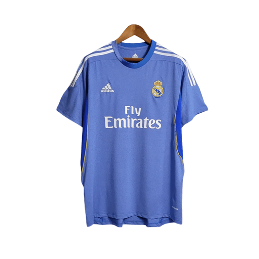 https://cdn.shopify.com/s/files/1/0826/7228/8075/files/20132014-real-madrid-fly-emirates-away-retro-kit-866954.webp?v=1741197459